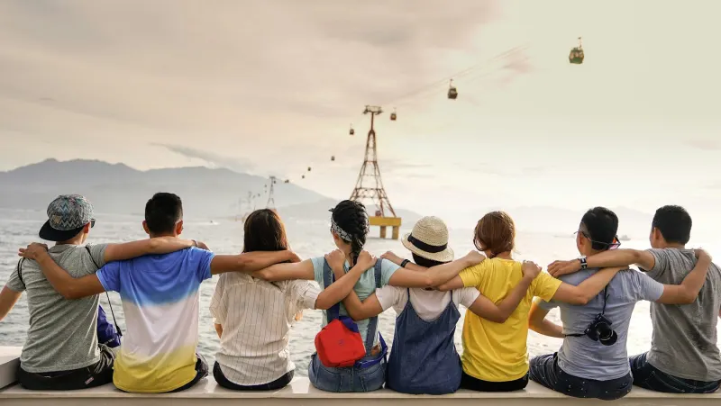 Group of friends laughing together outdoors